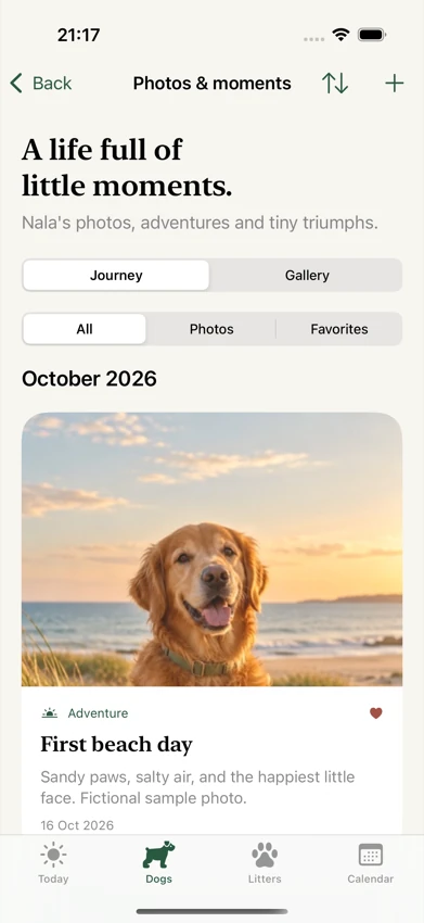 The app’s Journey view with a photo, caption, date and favorite heart for Nala’s first beach day